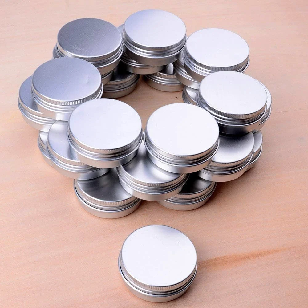 A stack of one-ounce tins waiting for balm
